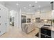 Spacious kitchen features custom cabinets, marble countertops, and stainless steel appliances at 3340 Fernlake Pl, Longwood, FL 32779