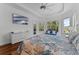 Cozy main bedroom offering exterior views, hardwood floors, and a TV for relaxing viewing at 3340 Fernlake Pl, Longwood, FL 32779
