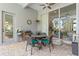 Covered patio with seating area, ceiling fan, exterior door and sliding glass door access to the home at 3340 Fernlake Pl, Longwood, FL 32779