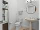 Stylish powder room features a pedestal sink, modern fixtures, and ample storage at 3340 Fernlake Pl, Longwood, FL 32779