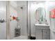 Contemporary bathroom featuring a tiled shower with glass door and a gray vanity at 345 Aquamarine Way, Daytona Beach, FL 32124