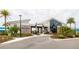 Exterior view of modern community clubhouse with welcoming entrance and palm tree landscaping at 345 Aquamarine Way, Daytona Beach, FL 32124