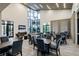 A modern common area with large windows and tables and chairs for socializing or working at 345 Aquamarine Way, Daytona Beach, FL 32124