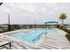Resort-style community pool with marked lap lanes, comfortable lounge chairs and lush landscaping at 345 Aquamarine Way, Daytona Beach, FL 32124