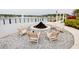 An inviting outdoor fire pit area with seating overlooking the lake and community, perfect for entertaining at 345 Aquamarine Way, Daytona Beach, FL 32124