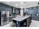 Spacious kitchen with gray cabinets, white countertops, stainless steel appliances, and a large island at 345 Aquamarine Way, Daytona Beach, FL 32124