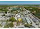 Neighborhood aerial view showing the property's location in a residential area with mature trees and nearby community features at 3748 Innisbrook Dr, Lakeland, FL 33810
