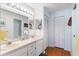 Bright bathroom featuring double sinks, a vanity, and lots of storage space at 3748 Innisbrook Dr, Lakeland, FL 33810