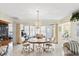 Bright dining area with tile flooring and a modern chandelier fixture at 3748 Innisbrook Dr, Lakeland, FL 33810