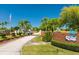 Welcoming entrance to Highland Fairways with manicured landscaping and brick signage at 3748 Innisbrook Dr, Lakeland, FL 33810