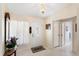 Bright foyer with tile flooring, decorative chandelier, and a view into the home at 3748 Innisbrook Dr, Lakeland, FL 33810