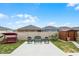 The spacious backyard features patio furniture, a shed, a vinyl fence, and lush grass at 434 Ironside Trail Dr, Groveland, FL 34736