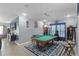 Spacious game room featuring a pool table, media, and comfortable seating area at 434 Ironside Trail Dr, Groveland, FL 34736