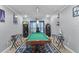 Game room featuring a pool table and decor, with natural light from the window at 434 Ironside Trail Dr, Groveland, FL 34736