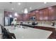 A full view of the kitchen featuring a large island, quartz countertops, and stainless steel appliances at 434 Ironside Trail Dr, Groveland, FL 34736