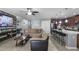 Open concept layout of the living room, kitchen, and game room for seamless entertaining at 434 Ironside Trail Dr, Groveland, FL 34736