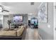Living room view into game room featuring modern decor and tile floors at 434 Ironside Trail Dr, Groveland, FL 34736