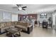 Open-concept living room and kitchen space with modern appliances and tile flooring at 434 Ironside Trail Dr, Groveland, FL 34736