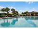 Community pool featuring lounge chairs and umbrellas with a view at 434 Ironside Trail Dr, Groveland, FL 34736