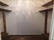 Walk-in closet with custom wood shelving and rod at 4350 Perkinshire Ln # 108, Orlando, FL 32822