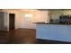 Open living space with updated kitchen, dark wood-look floors and contemporary lighting at 4350 Perkinshire Ln # 108, Orlando, FL 32822