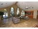 Relaxing lobby with vaulted ceilings, neutral paint and flooring, and comfortable furnishings at 4350 Perkinshire Ln # 108, Orlando, FL 32822