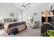 Spacious main bedroom with plush carpet, vaulted ceilings, and stylish decor with access to en suite bathroom at 442 Troon Cir, Davenport, FL 33897