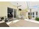 Screened patio featuring an outdoor dining area offers peaceful view of pool and backyard at 442 Troon Cir, Davenport, FL 33897