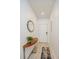 Entrance hallway featuring tiled floors, console table with modern decor, and a welcoming atmosphere at 4751 Clock Tower Dr # 203, Kissimmee, FL 34746
