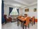 Inviting living room with neutral tones, comfortable seating, dining area, and natural light, perfect for relaxation at 4751 Clock Tower Dr # 203, Kissimmee, FL 34746
