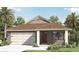 Charming single-Gathering home featuring a two-car garage and a well-manicured lawn with tropical landscaping at 491 Taylor Groves Dr, Lake Wales, FL 33898