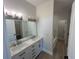 This bathroom has dual sinks with a marble countertop and an additional bathtub with shower at 493 E Palmetto Ave, Longwood, FL 32750