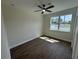 Bedroom with a ceiling fan, wood floors, and ample natural light at 493 E Palmetto Ave, Longwood, FL 32750