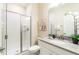 Well-lit bathroom featuring a glass-enclosed shower and contemporary vanity at 4962 Windermere Ave, Kissimmee, FL 34746