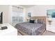 Cozy bedroom with neutral tones, stylish bedding, and ample natural light at 4962 Windermere Ave, Kissimmee, FL 34746
