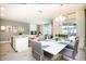 Bright dining area featuring a modern chandelier and seamless connection to outdoor patio space at 4962 Windermere Ave, Kissimmee, FL 34746