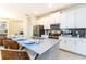 Modern kitchen featuring a large island, stainless steel appliances, and white cabinetry at 4962 Windermere Ave, Kissimmee, FL 34746