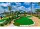 Fun mini-golf course surrounded by trees and rocks at 4962 Windermere Ave, Kissimmee, FL 34746