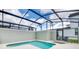 Inviting private pool area with a screen enclosure and lounge chairs at 4962 Windermere Ave, Kissimmee, FL 34746