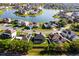 Stunning aerial view of a lakeside community with beautiful homes and lush green landscaping at 5456 Crepe Myrtle Cir, Kissimmee, FL 34758