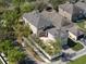 Aerial image of home and landscaping including driveway and sidewalks in a suburban neighborhood at 6475 New Independence Pkwy, Winter Garden, FL 34787