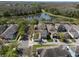 Aerial view of property overlooking a pond and walking path in a wooded area at 6475 New Independence Pkwy, Winter Garden, FL 34787