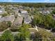 Aerial view of property on a tree-lined street; home is framed in red for definition at 6475 New Independence Pkwy, Winter Garden, FL 34787