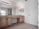 Primary bathroom features a double sink vanity and large mirror at 6475 New Independence Pkwy, Winter Garden, FL 34787