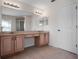 Primary bathroom features a double sink vanity and large mirror at 6475 New Independence Pkwy, Winter Garden, FL 34787