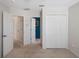 Hallway with a linen closet and access to the bedrooms at 6475 New Independence Pkwy, Winter Garden, FL 34787