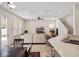 Open concept living room with ample seating, neutral paint, and convenient bar seating at 6475 New Independence Pkwy, Winter Garden, FL 34787