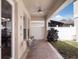 Relaxing outdoor patio featuring tiled flooring, a ceiling fan, and seating for two at 6475 New Independence Pkwy, Winter Garden, FL 34787