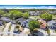 An aerial view showcases the neighborhood featuring manicured lawns and tree-lined streets at 6921 Blair Dr, Orlando, FL 32818