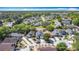 An aerial view showcases the neighborhood featuring manicured lawns and tree-lined streets at 6921 Blair Dr, Orlando, FL 32818